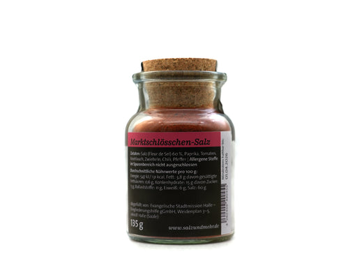 Ein 135-g-Glas mit Korkdeckel und der Aufschrift „Marktschlösschen-Salz groß“. Diese rosafarbene Gewürzmischung mit rosa-schwarzem Etikett eignet sich hervorragend als Brathähnchen oder Pommes-Gewürzsalz. Zutaten- und Nährwertangaben sind enthalten.